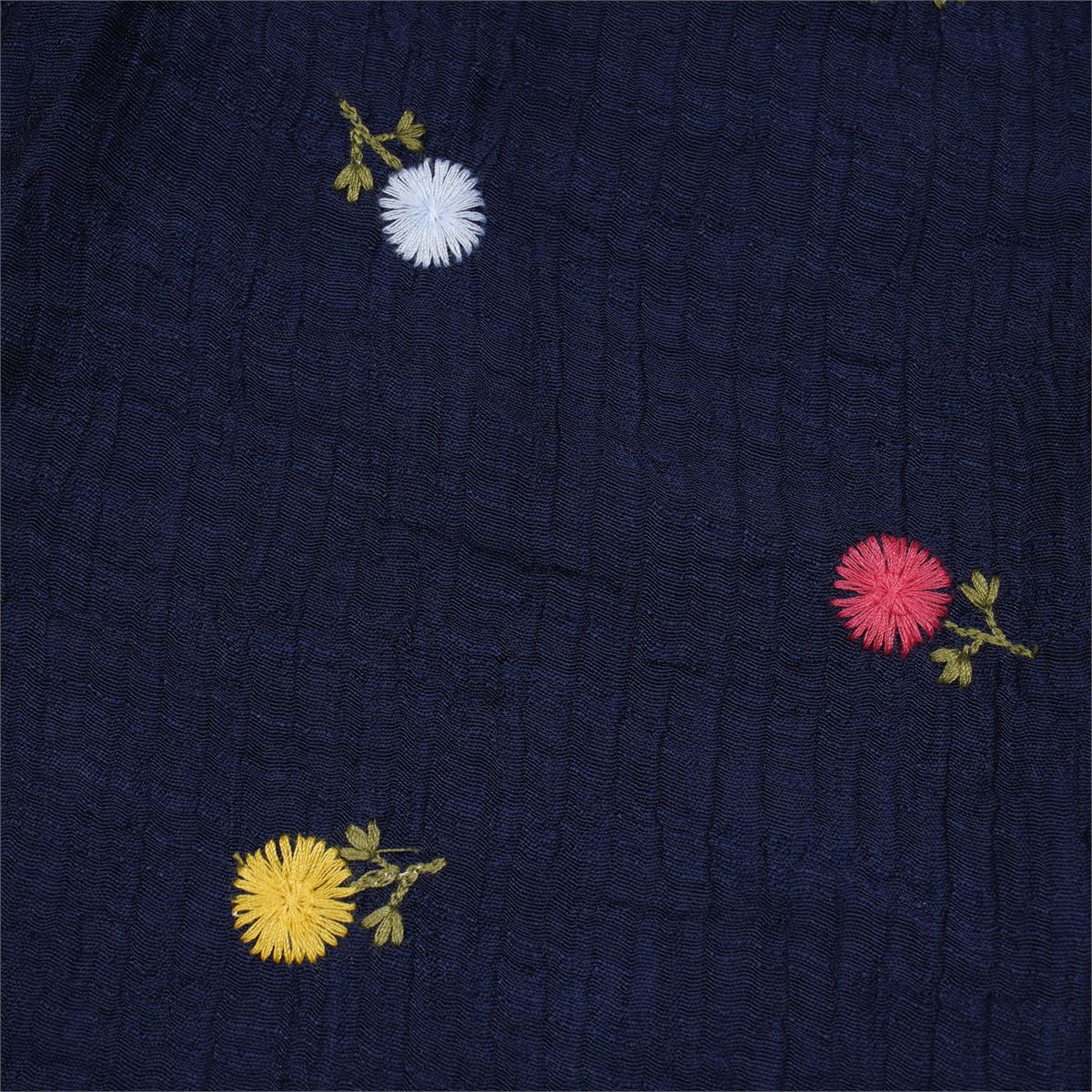 Justtots A chic two-piece navy blue textured cotton set featuring a stitch-detailed button-down shirt and matching floral embroidered trousers with tassel pockets.